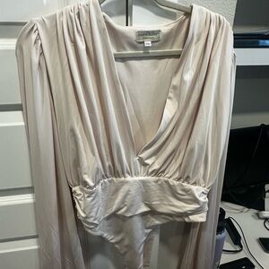 Cream Bodysuit with Plunging V-Neckline and Long Sleeves